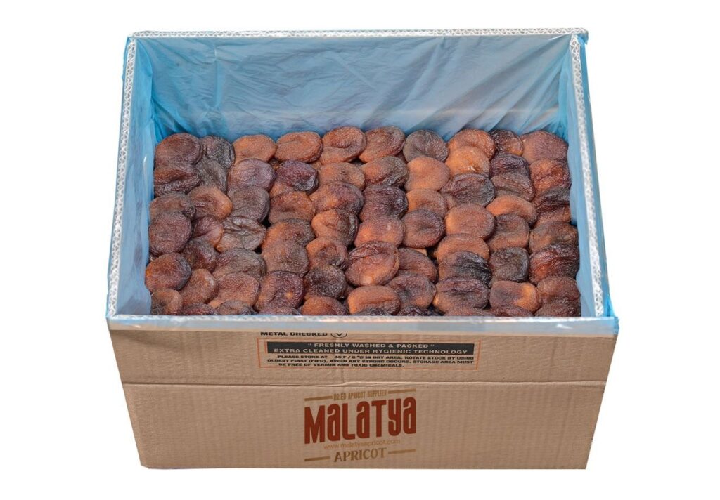 Bulk box of premium sun-dried apricots in export packaging